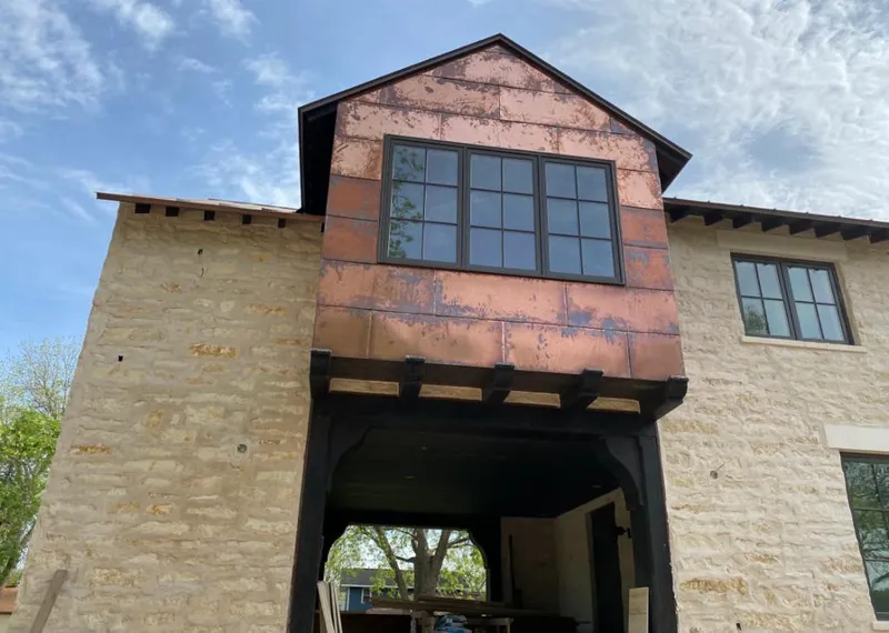 Copper metal panel facade on a stone building for Metal Roof Coating in Lake Zurich
