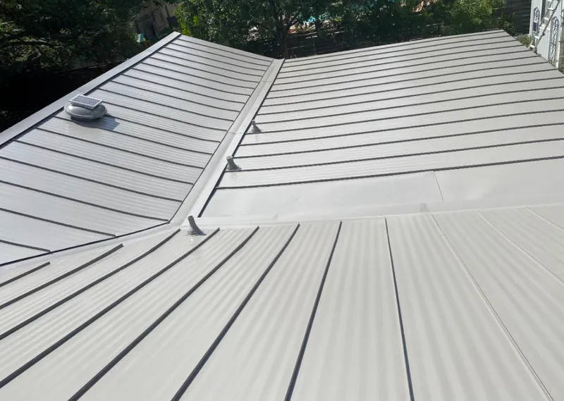 Solar attic fan installed on a metal roof for Roof Ventilation in Lake Zurich
